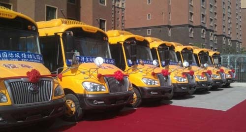 宇通“六一”獻禮烏魯木齊幼兒園 10輛專用校車交付